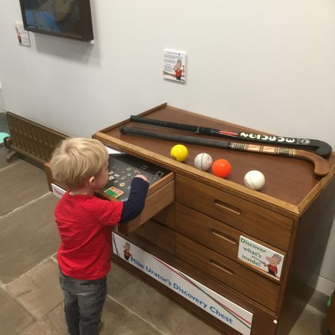 IMG_4842 Young boy admires hockey display | Courtesy of The Hockey Museum