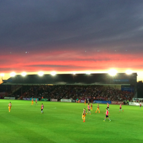 Screen-Shot-2017-05-02-at-14.56.21 Evening sky over a football match watched by spectators in a full stand | Image courtesy of the Grecian Archive
