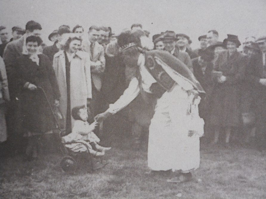 Ras Prince Monolulu entertains the crowd at Warwick Racecourse. Image from 'Bygone Warwickshire: A Photo History of our County', Leamington Spa Courier. Ras Prince Monolulu entertains the crowd at Warwick Racecourse. Image from 'Bygone Warwickshire: A Photo History of our County', Leamington Spa Courier. | Warwickshire County Record Office reference PH557/page 20
