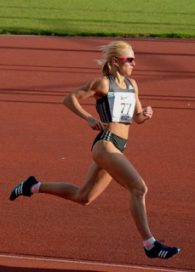 Jenny Meadows running on a track