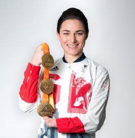 Dame Sarah Storey DBE with three gold medals