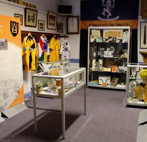 The Story of the U's mini-museum – general view Various items in display cabinets at The Story of the U's museum | The Story of the U's