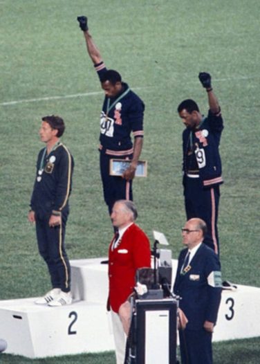Peter Norman, Tommie Smith and John Carlos, on the podium at the1968 Olympics | Angelo Cozzi (Mondadori Publishers) [Public domain]