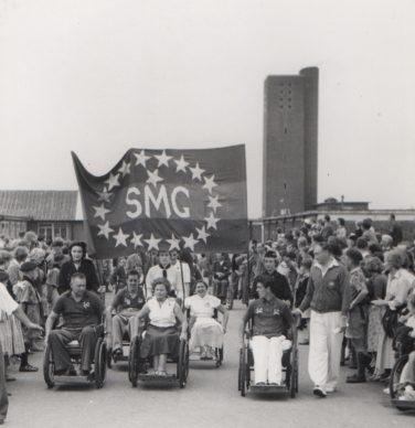 Black and white photo of a procession at the fifth international paralympics | National Paralympic Heritage Trust