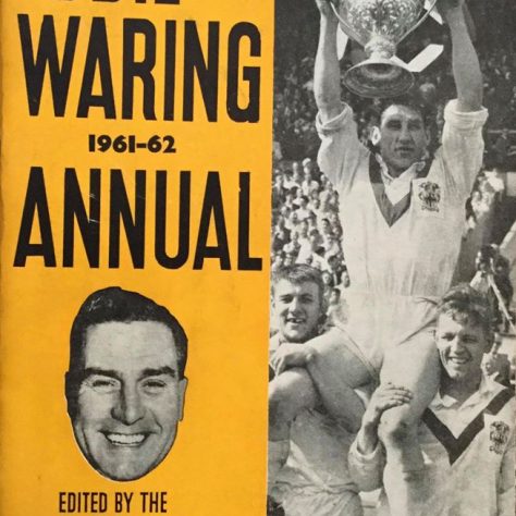An Eddie Waring annual Cover of an Eddie Waring Annual with a black and white photo of a player lifting a trophy | Dewsbury Memories