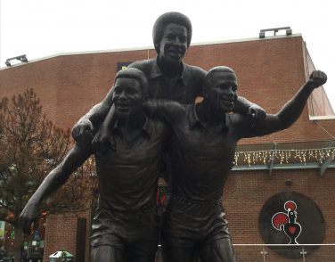 Statue of three men celebrating | Courtesy of Bill Hern