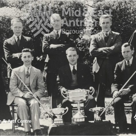 St Comgall's Billiards Team 1936 Black and white team photo with three trophies | Larne Museum & Arts Centre / Mid & East Antrim Borough Council