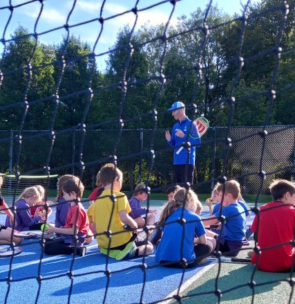 Children take place in a tennis session