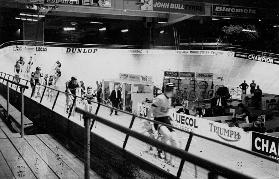 Cyclists race around indoor track. | Brian Townsley (CC by 2.0)