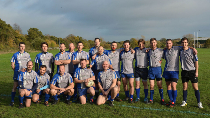 Mens team on grass pitch, wearing rugby kit | Kings Cross Steelers