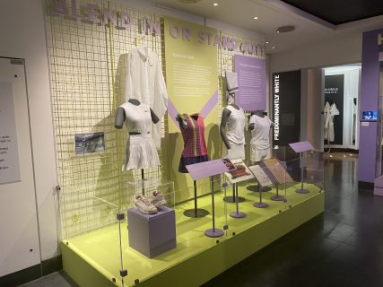 View of tennis outfits in a pale green and lilac display as part of the Express Yourself: Sport, Street, Style exhibition at Wimbledon Lawn Tennis Museum