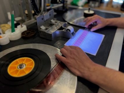 A photograph of a reel of film being digitised | The Ark Heritage