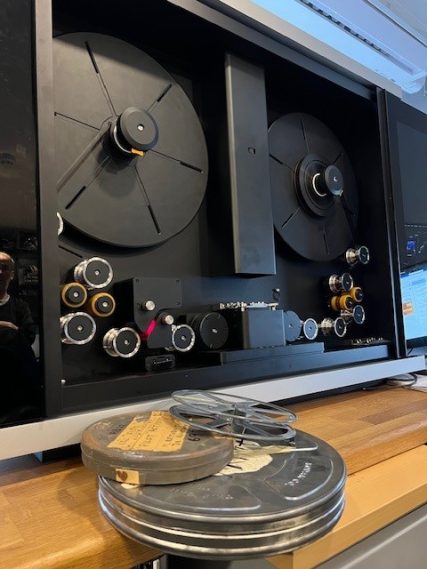 A photograph of a reel of film being digitised | The Ark Heritage