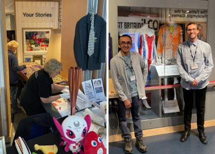 (L) Two female volunteers working on table holding Paralympic torches, mascots and costume designs. (R) Two male trainees in front of new costume display.