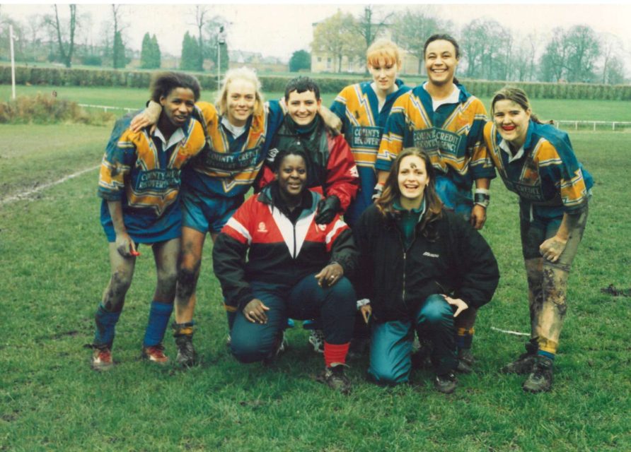Dudley Hill & Sheffield Players 2000. Women In Rugby League Dudley Hill & Sheffield Players group photoon playing field. Girls in muddied rugby kits. | Women In Rugby League